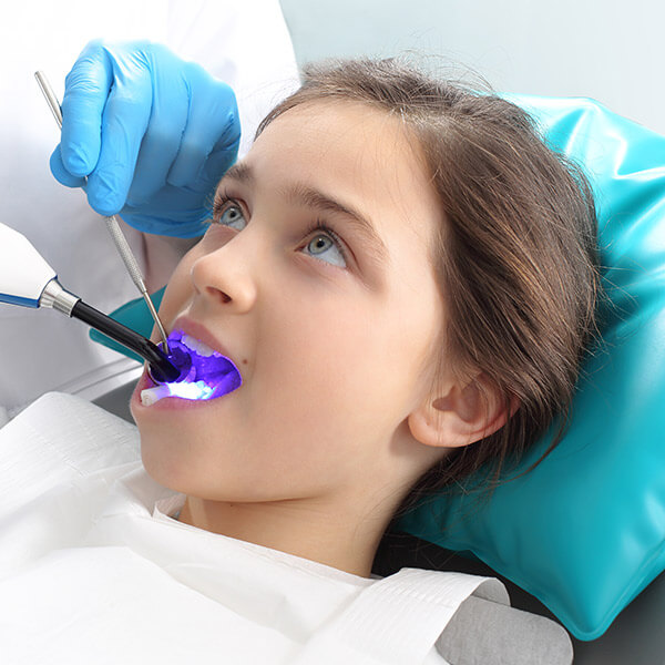 A child getting a dental exam.