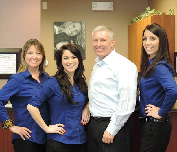 The team at Lakota Dental poses for a picture.